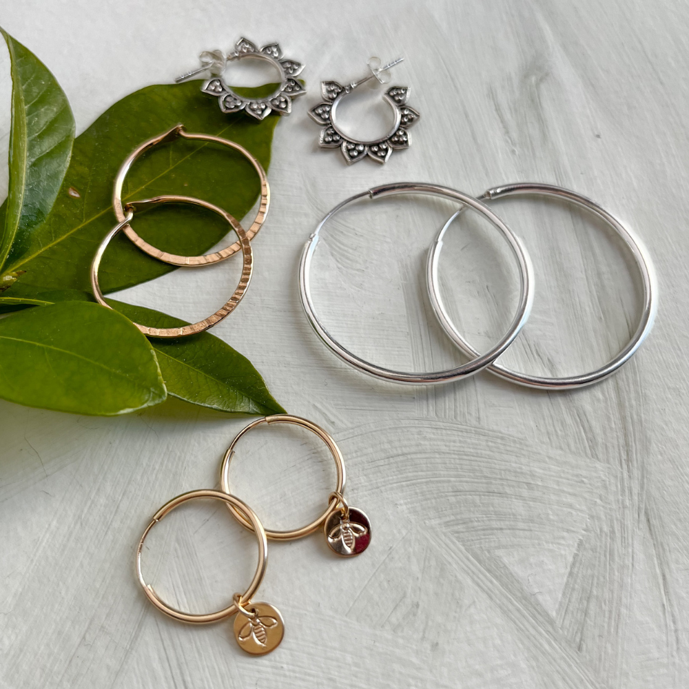 Image of a person wearing hoop earrings