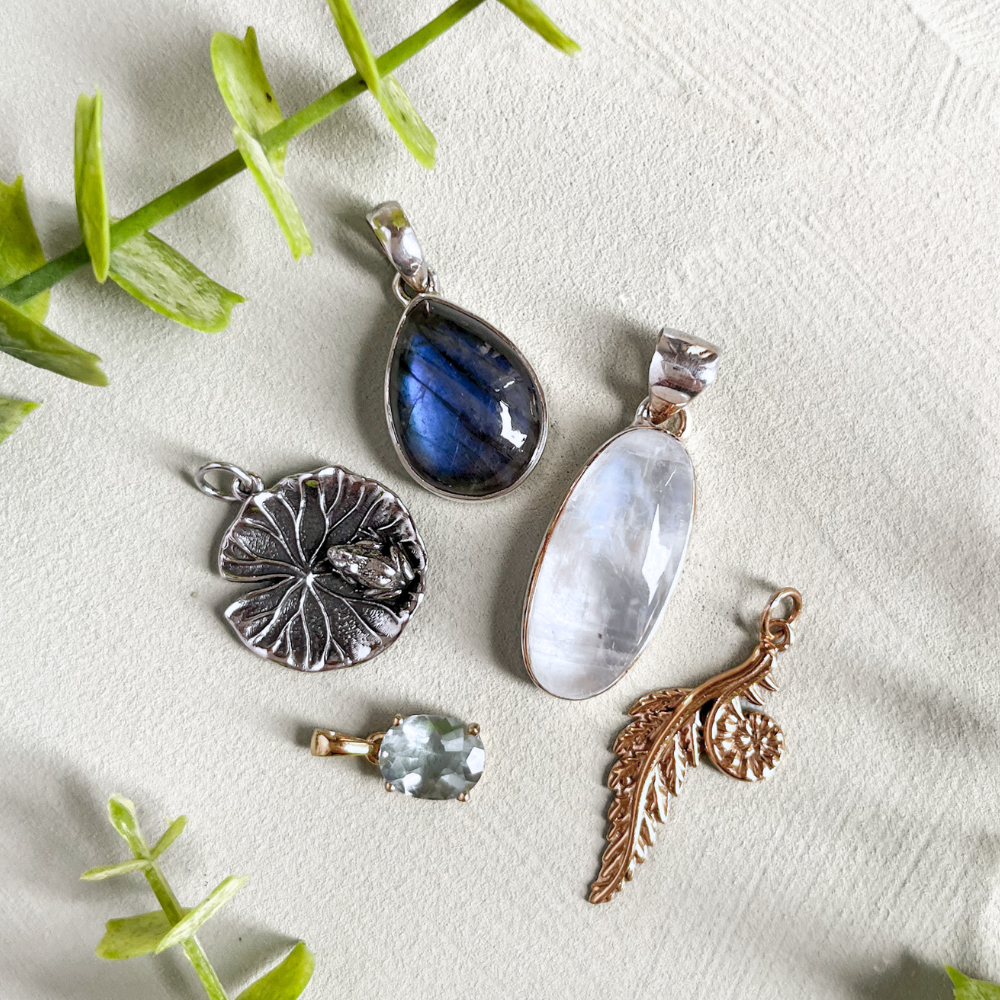 Image of a hand holding pendants